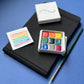 Kit luxe - Palette d'aquarelles artisanales She's a Rainbow + carnet + pinceau